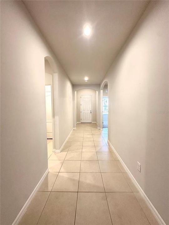 Hallway view towards the front door from the livingroom area