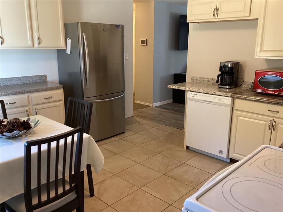 Refrigerator and dishwasher stay with the property.