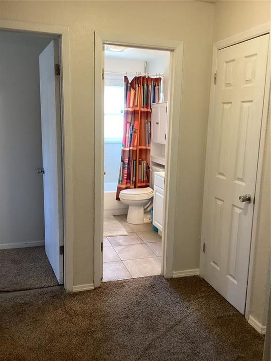 Full bath, bedroom 2, and closet one from hallway