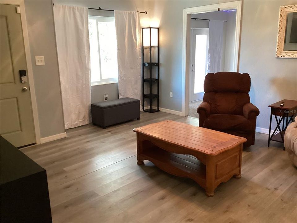 Living room with front door.