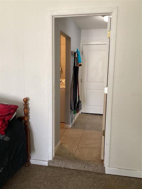 Utility room between bonus room, laundry room, and back door.