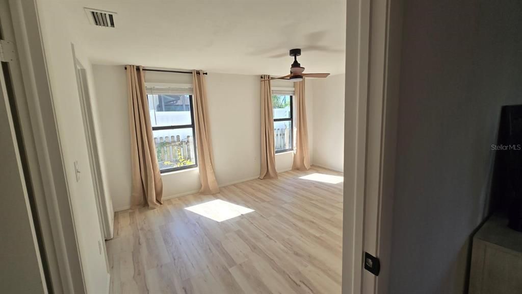 primary bedroom with a large walk in closet and en-suite bath