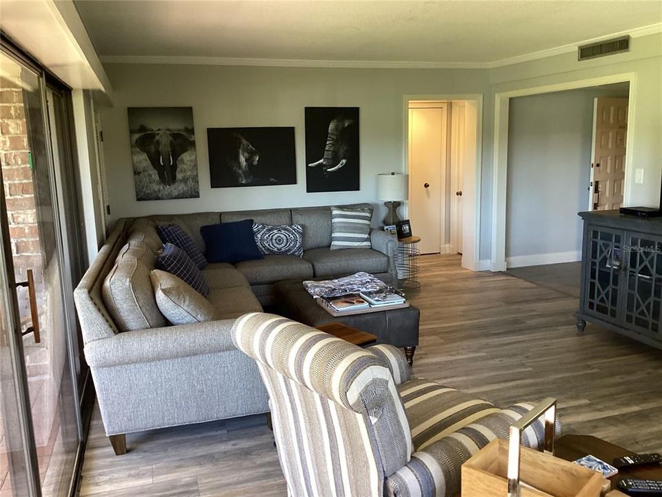 Living room looking towards front door and bedrooms.