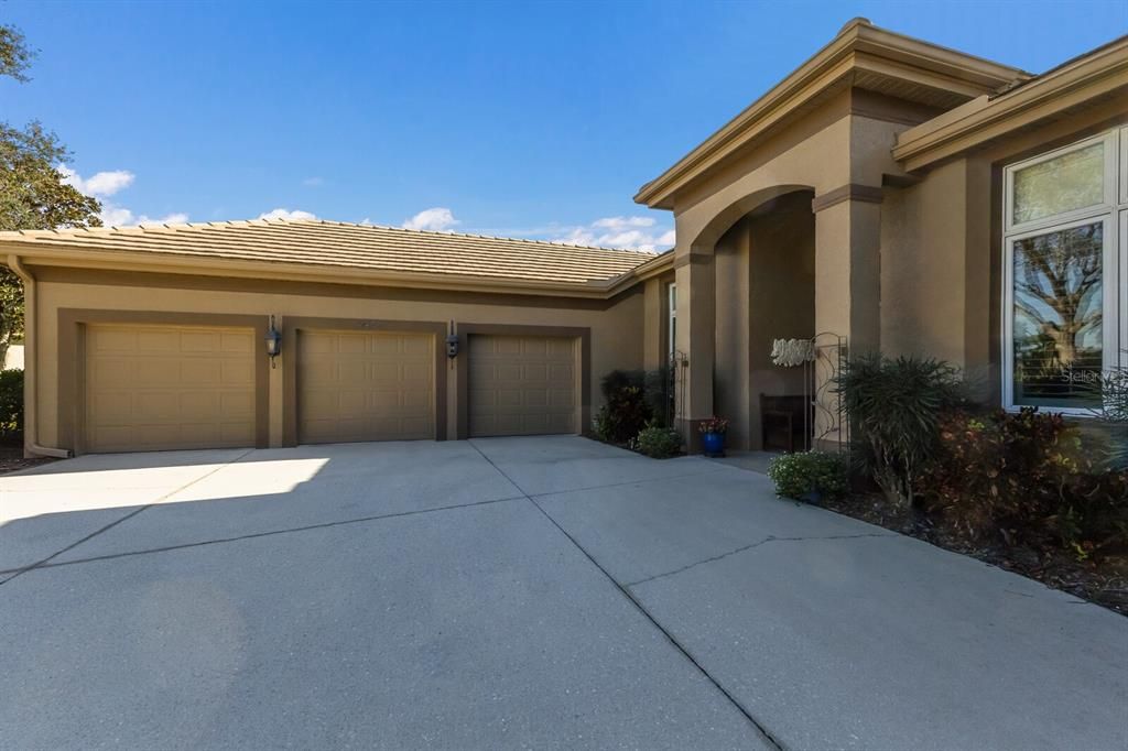 Full 3 car garage with rear entry door