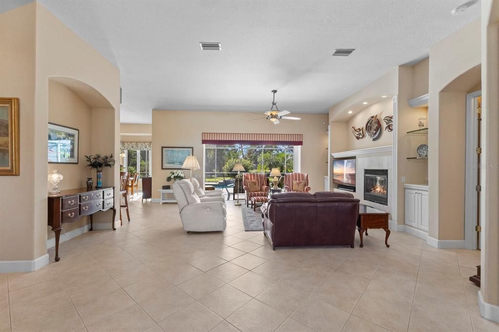 Great room with views of the pool, rear yard and golf course