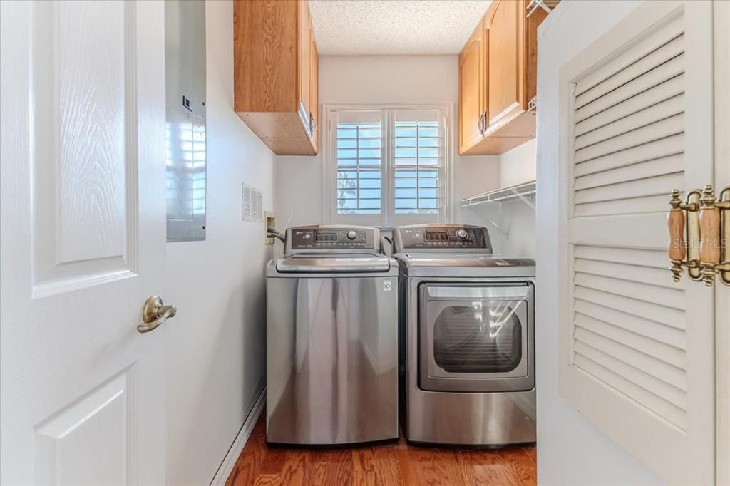 Laundry Room with Washer & Dryer + Tankless Water Heater