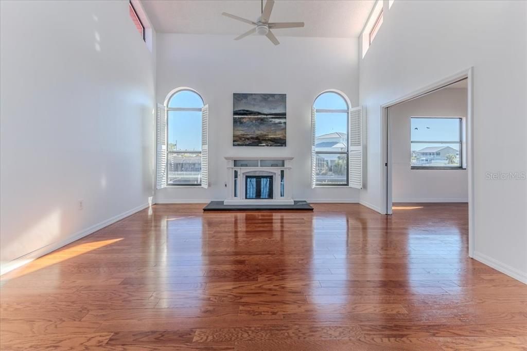 Living Room with Soaring Ceilings & Wood Floors