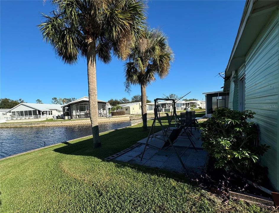 Patio and back yard on the water