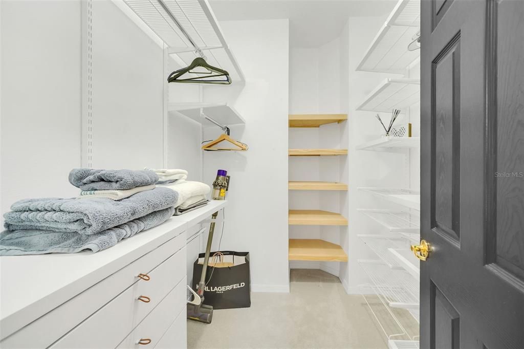 Walk-In Closet with Custom Built in Shelves