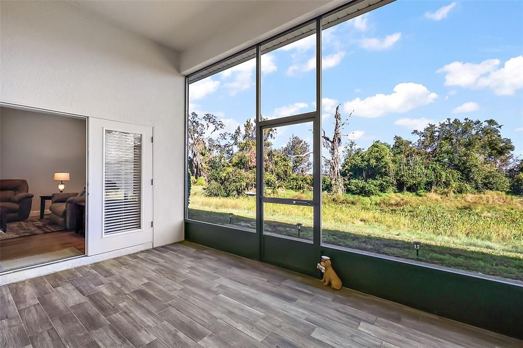 Tiled rear screen porch with amazing views