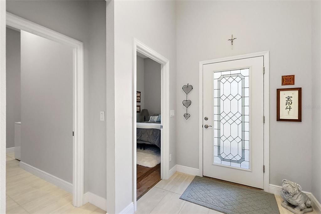 Gorgeous glass lead front door. Laundry room and garage entry through the left door