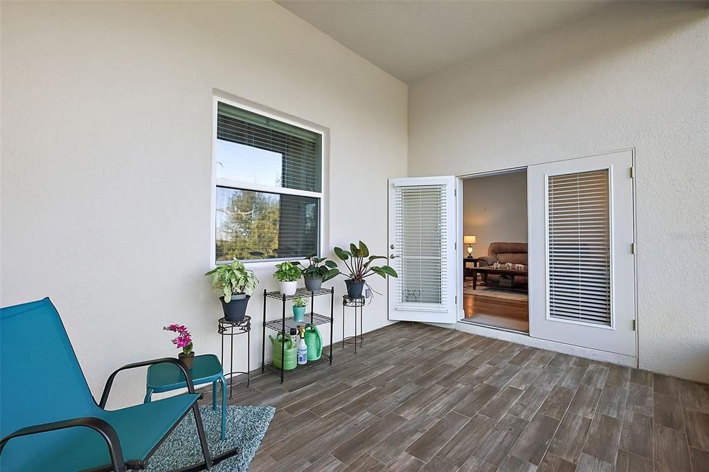 French doors leading out to rear screen patio