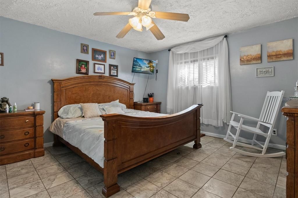 Master bedroom shares a massive bathroom with a jet-tub and shower.