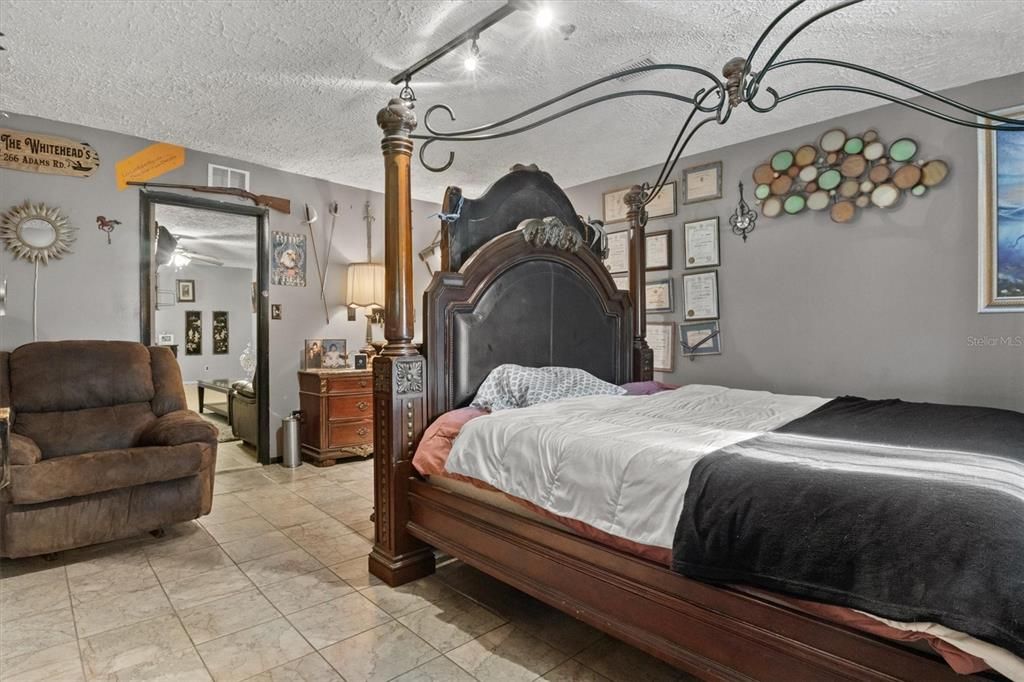 Master bedroom shares a massive bathroom with a jet-tub and shower.