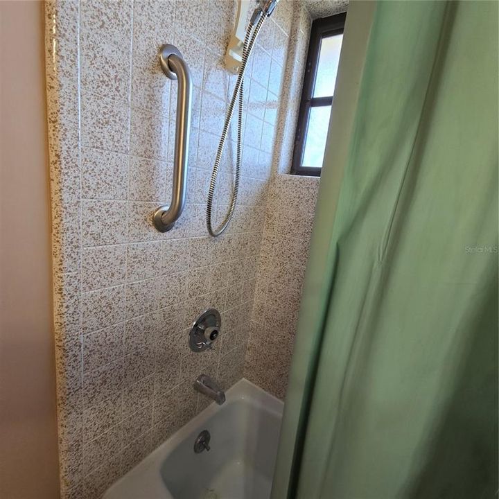 Tile in shower/tub in bathroom 2