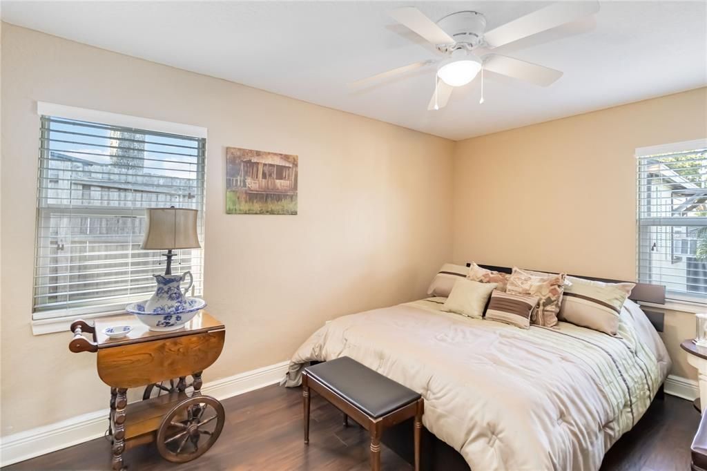 Guest bedroom with two windows for plenty of light.