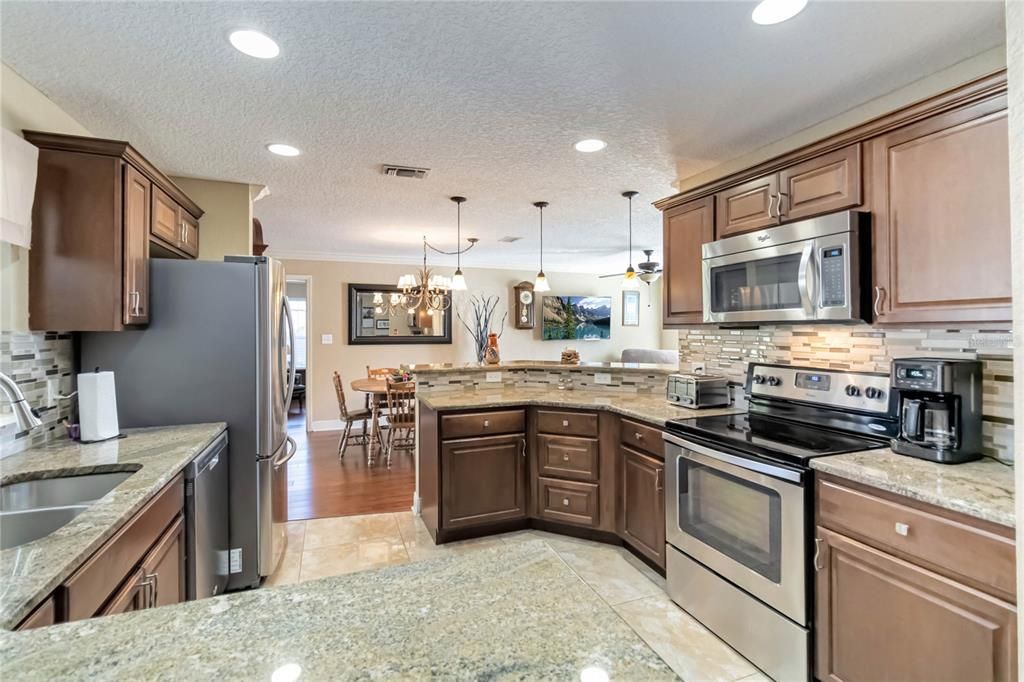 Beautifully renovated kitchen with stainless steel appliances.