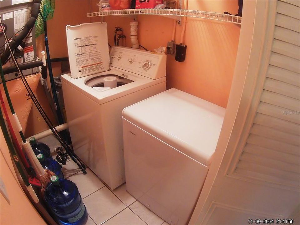 Washer and Extra Freezer Storage in Entryway Closet