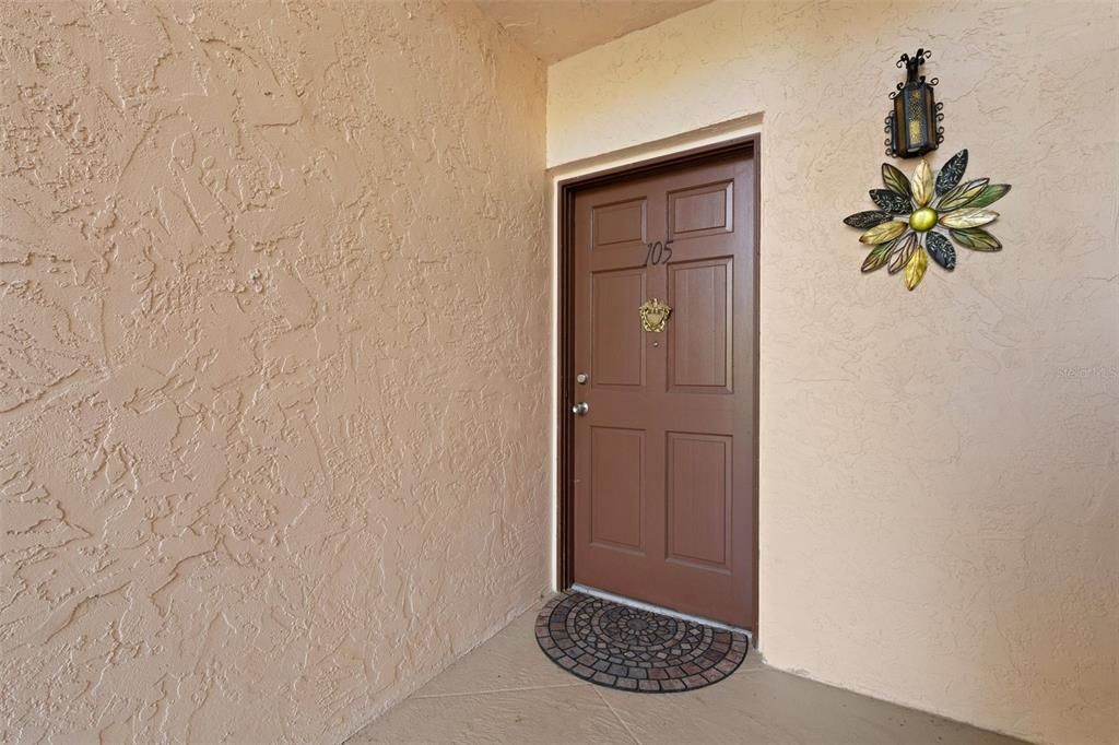 Unit 105 Front Door to Unit Entryway