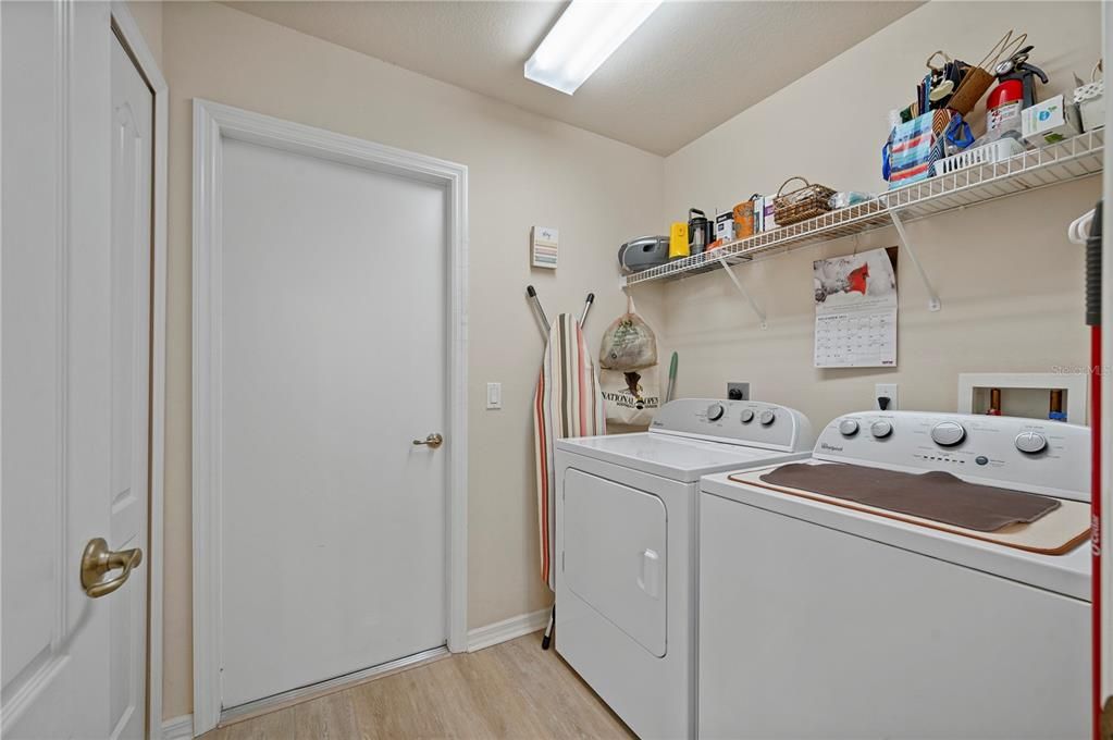 Inside Laundry Room with extra closet storage