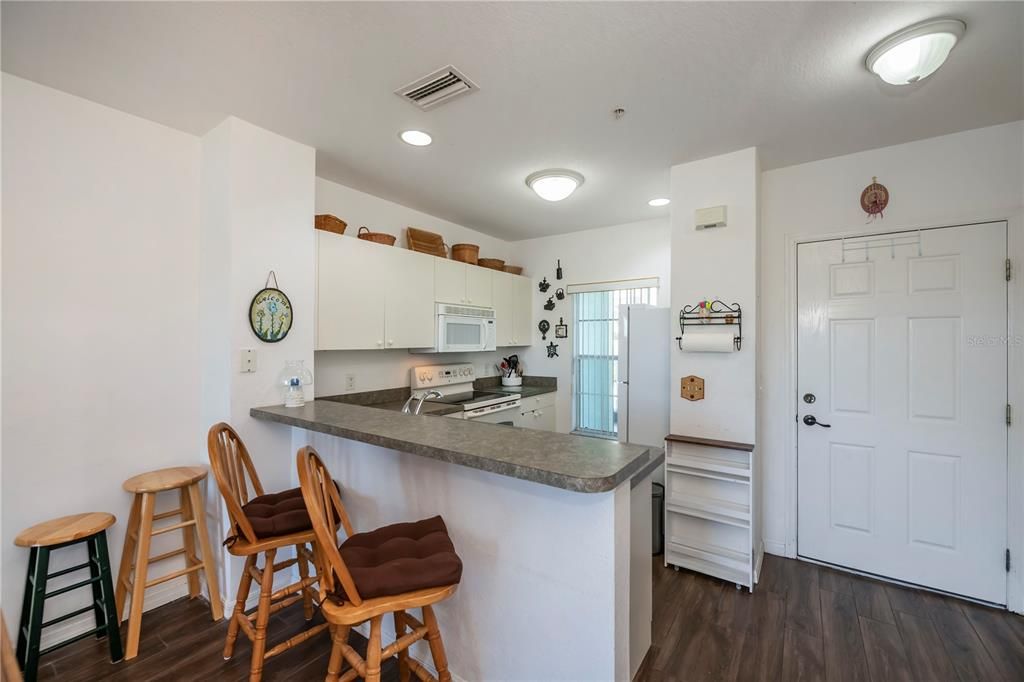 front door and kitchen