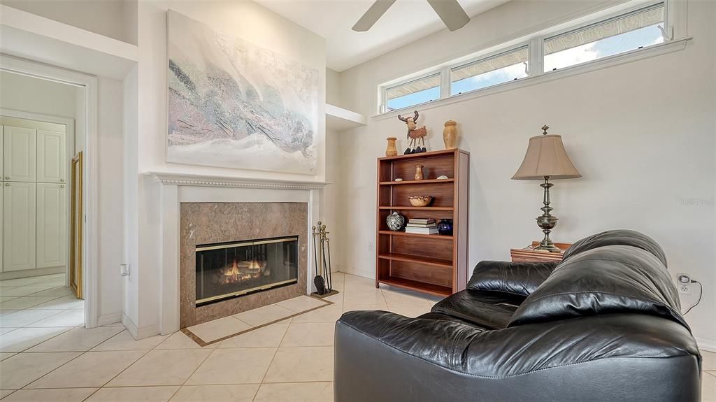 Wood burning fireplace off of kitchen