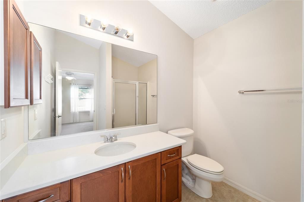 The primary bath. the shower is reflected in the mirror.