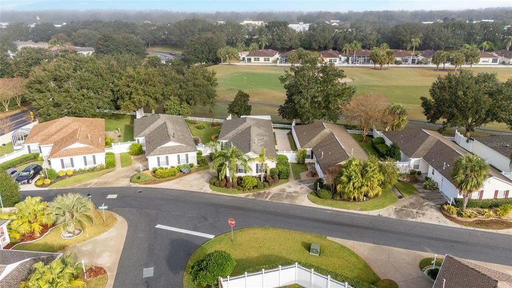 behind the villas on the FAR side of the course is Mulberry Shopping Center.