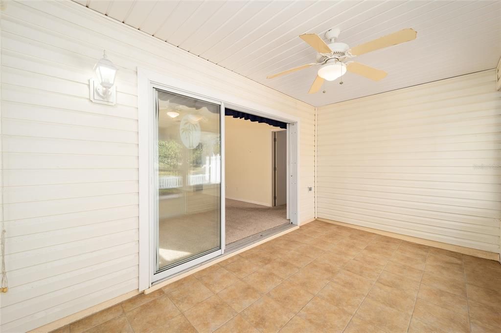 The sliders into the villa from the enclosed, tiled lanai.