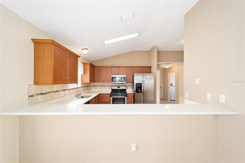 Stainless appliances and a neutral backsplash are a great blend in the kitchen