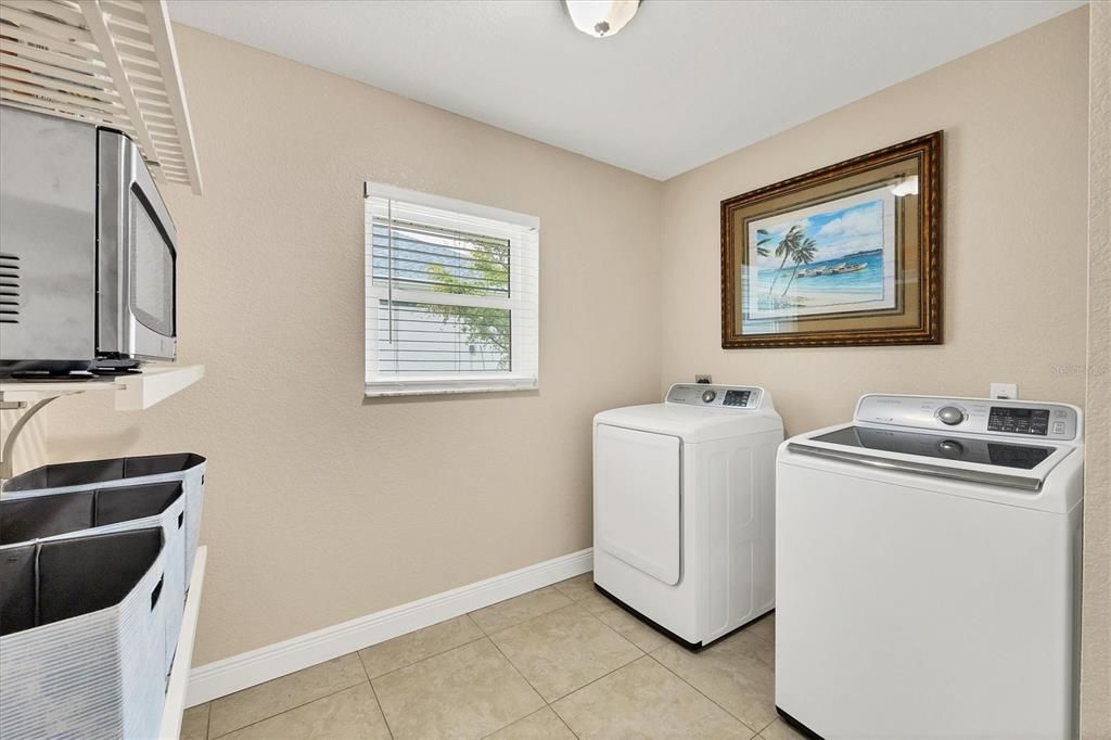 Spacious Laundry Room Offering Plenty of Storage and Functionality