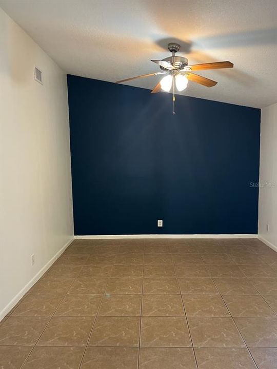 Family room with tall ceiling & view onto Florida Room.