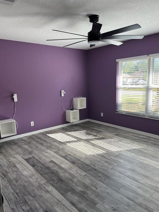 Primary Bedroom has vinyl flooring and features extra closets