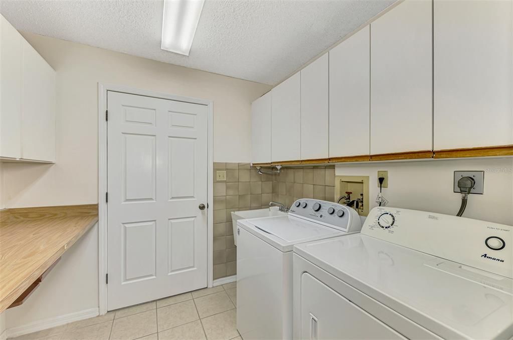 Laundry room leading to garage