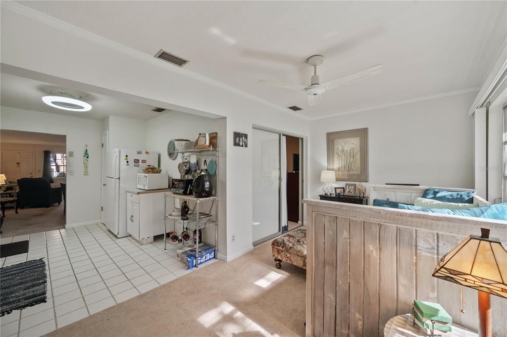 Florida Room, Kitchen on left, door to Primary Bedroom in center of photo