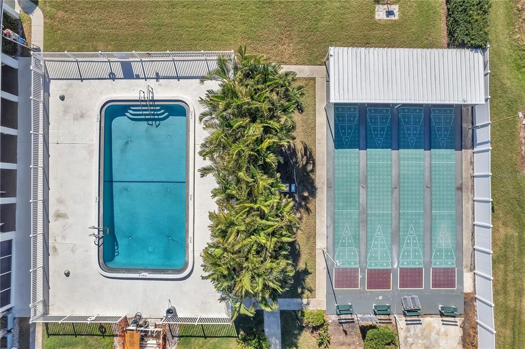 Pool and shuffleboard.  Clubhouse to the left of pool.