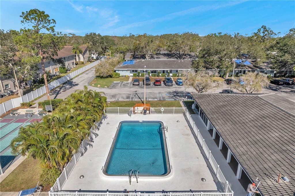 Pool with clubhouse to the right.