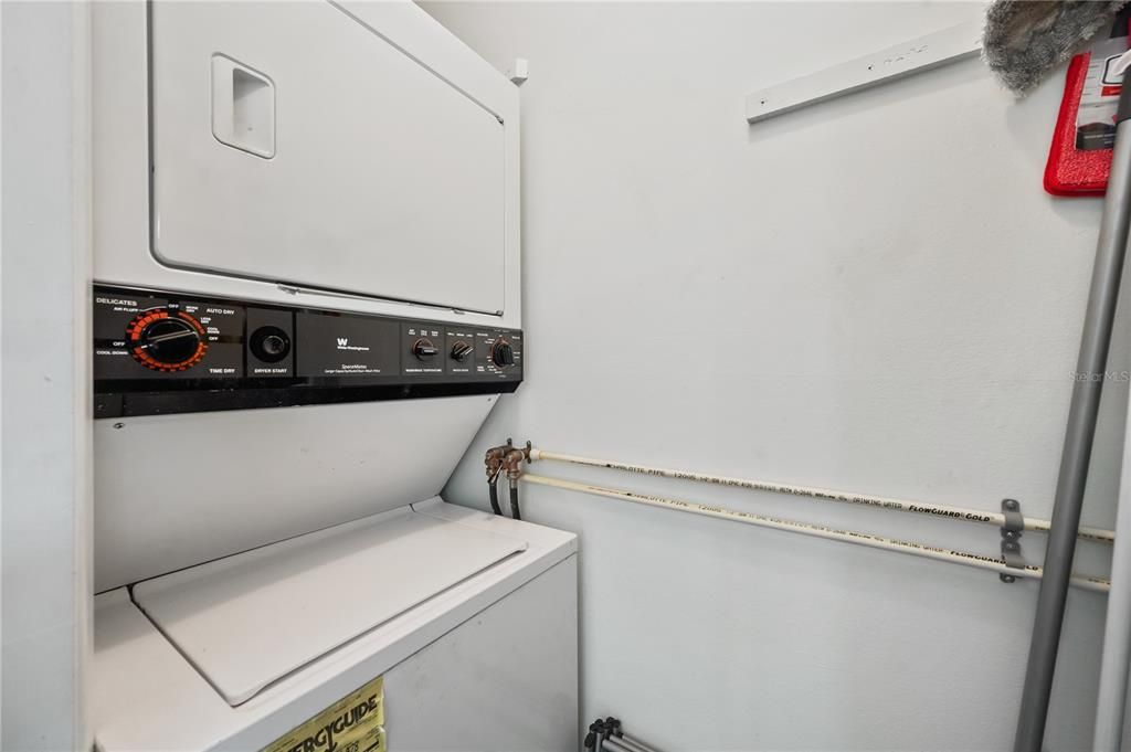 Washer Dryer combo in utility closet off Florida Room