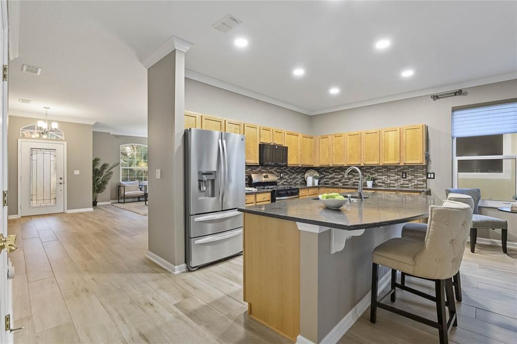 View of the 14' x 10'6" Kitchen w/ Quartz countertops & breakfast island