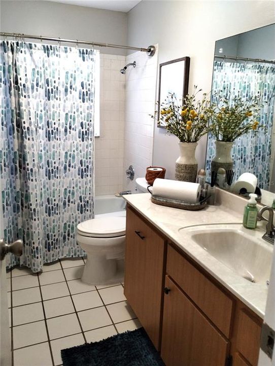 Bathroom #2 has neutral tile colors