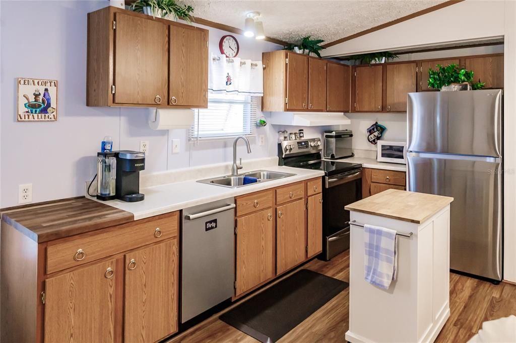 Kitchen with newer stainless appliances, including dishwasher