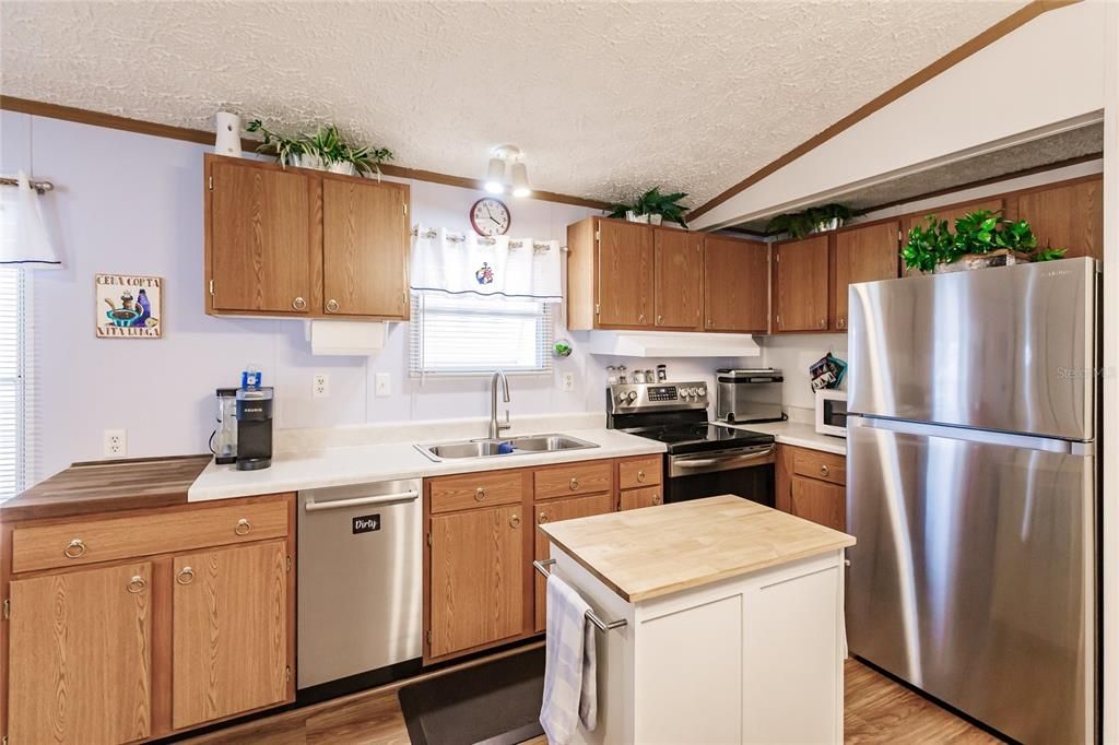 Kitchen with newer stainless appliances, including dishwasher