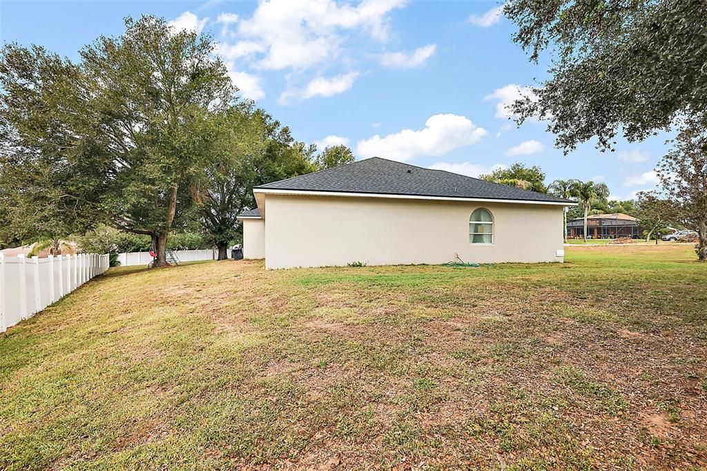 Spacious and partially fenced backyard