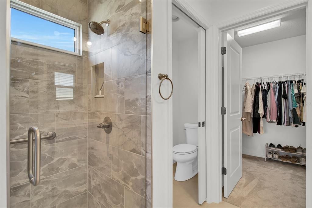 Primary Bathroom Shower, Toilet & Walk-In Closet