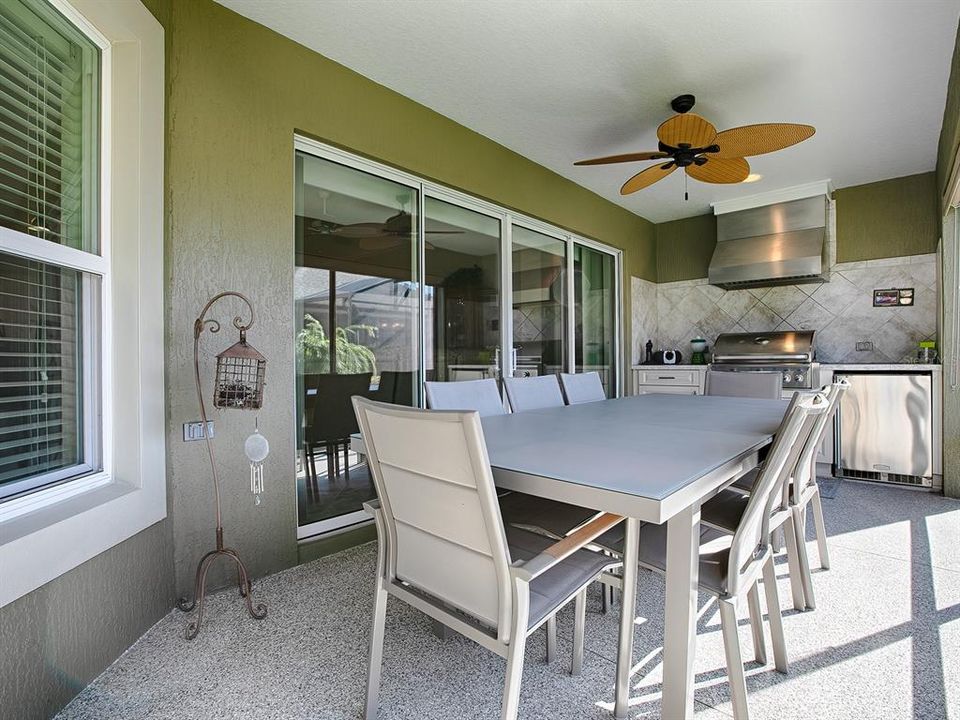 SLIDING GLASS DOORS FROM THE LIVING ROOM OPEN TO THE LANAI AND SUMMER KITCHEN.