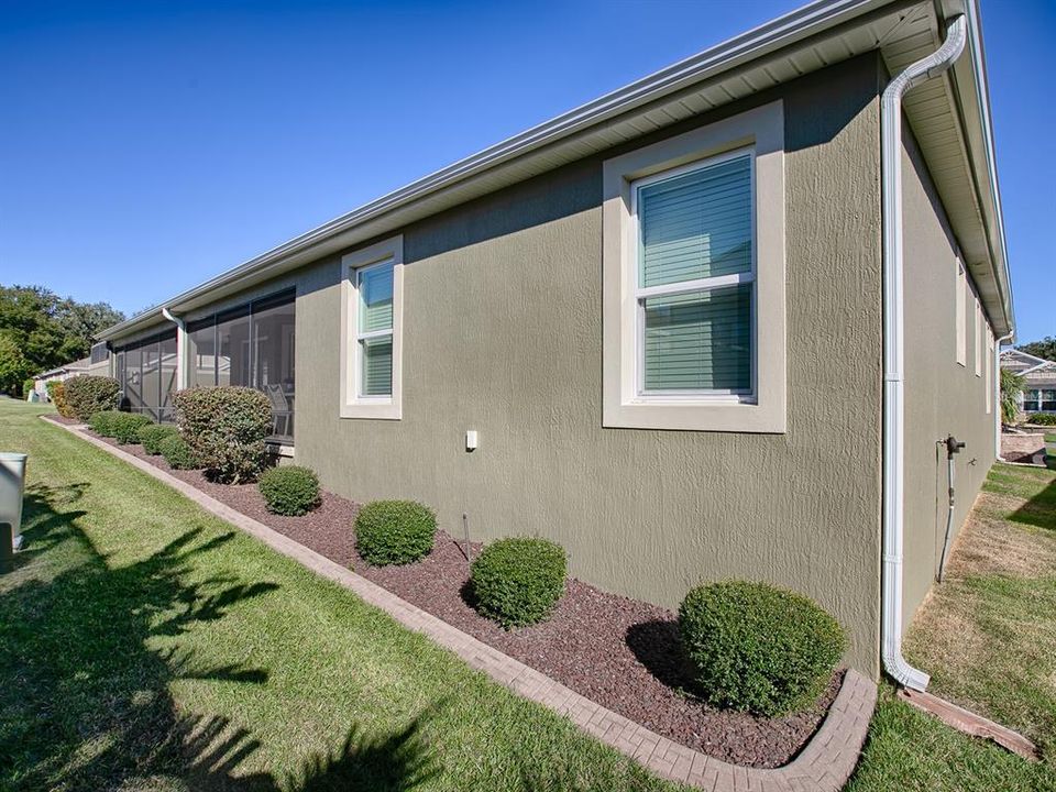 GUTTERS AROUND THE ENTIRE HOME. REAR IS NICELY LANDSCAPED WITH CURBING AND ROCK BEDS.