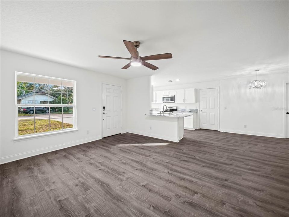 Luxury vinyl plank flooring throughout.