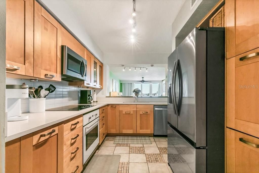 Kitchen - closet pantry is to the right of the refrigerator.