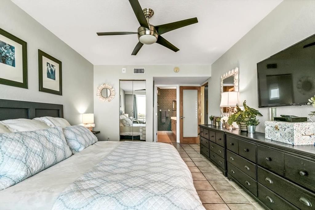 Master bedroom. Mirrored doors open to walk in closet. To the right of the mirrored doors is the master bath.