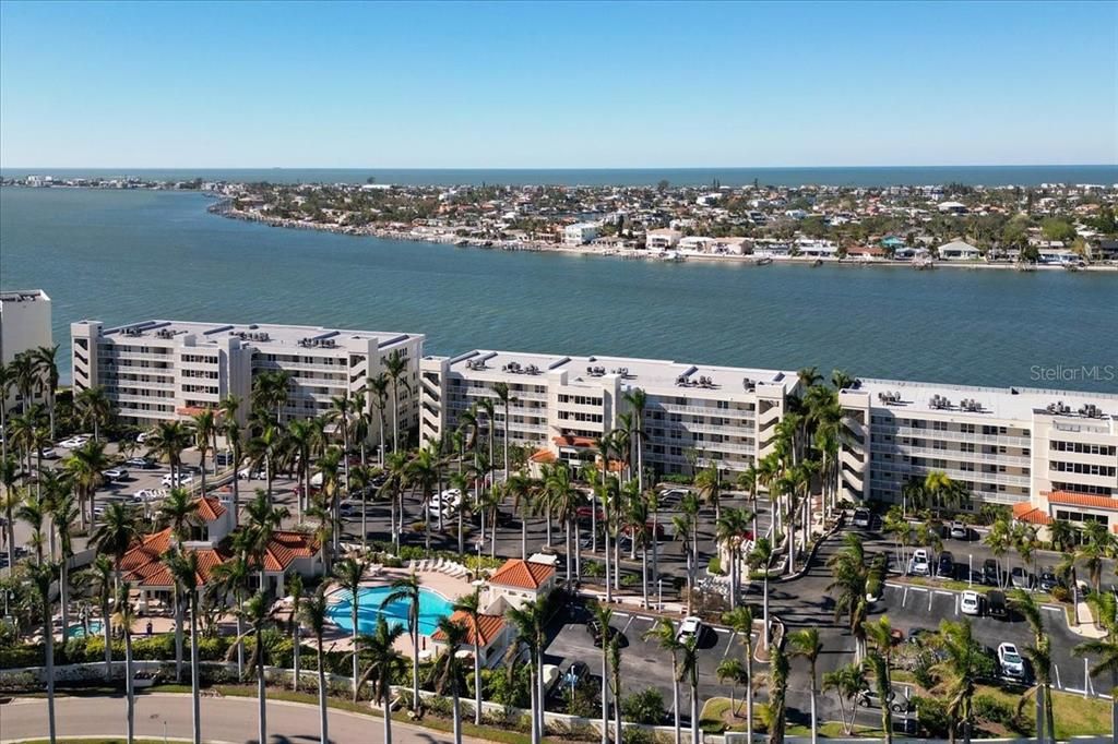 Aerial view to the southwest over Vina del Mar and Passagrille to the Gulf of Mexico. 6085 is the building in the center. Unit 366 is the second unit in from the left end of the building on the third floor.